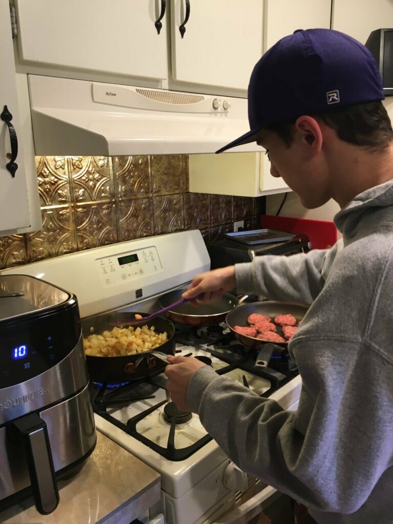 Carson cooks dinner